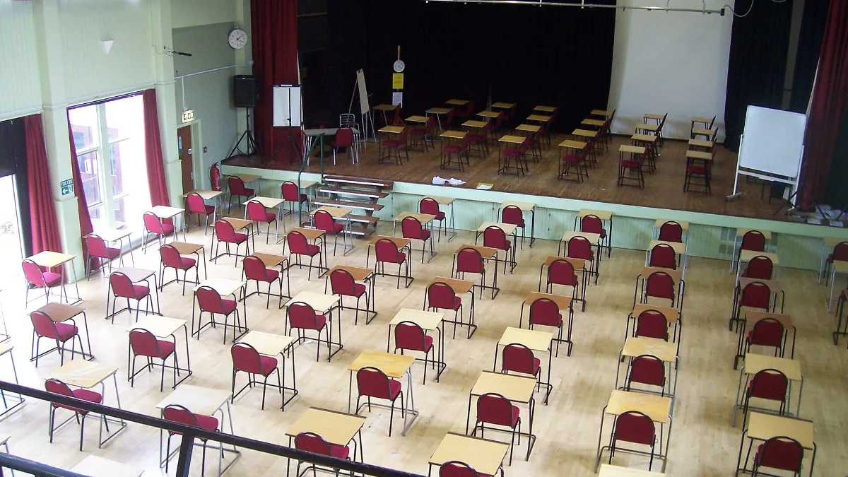 Exam hall set up with rows of desks, similar to an HSK exam test centre